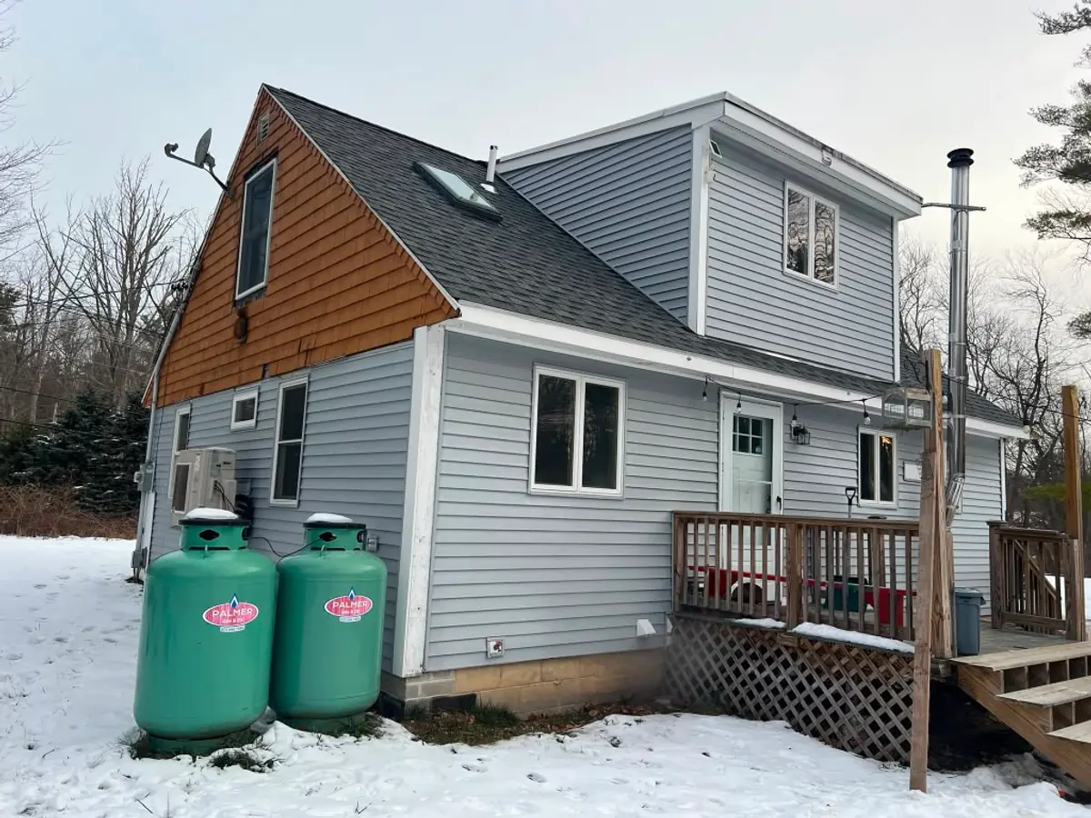 Whole-House Siding Replacement in Atkinson, NH - Before renovation, original condition